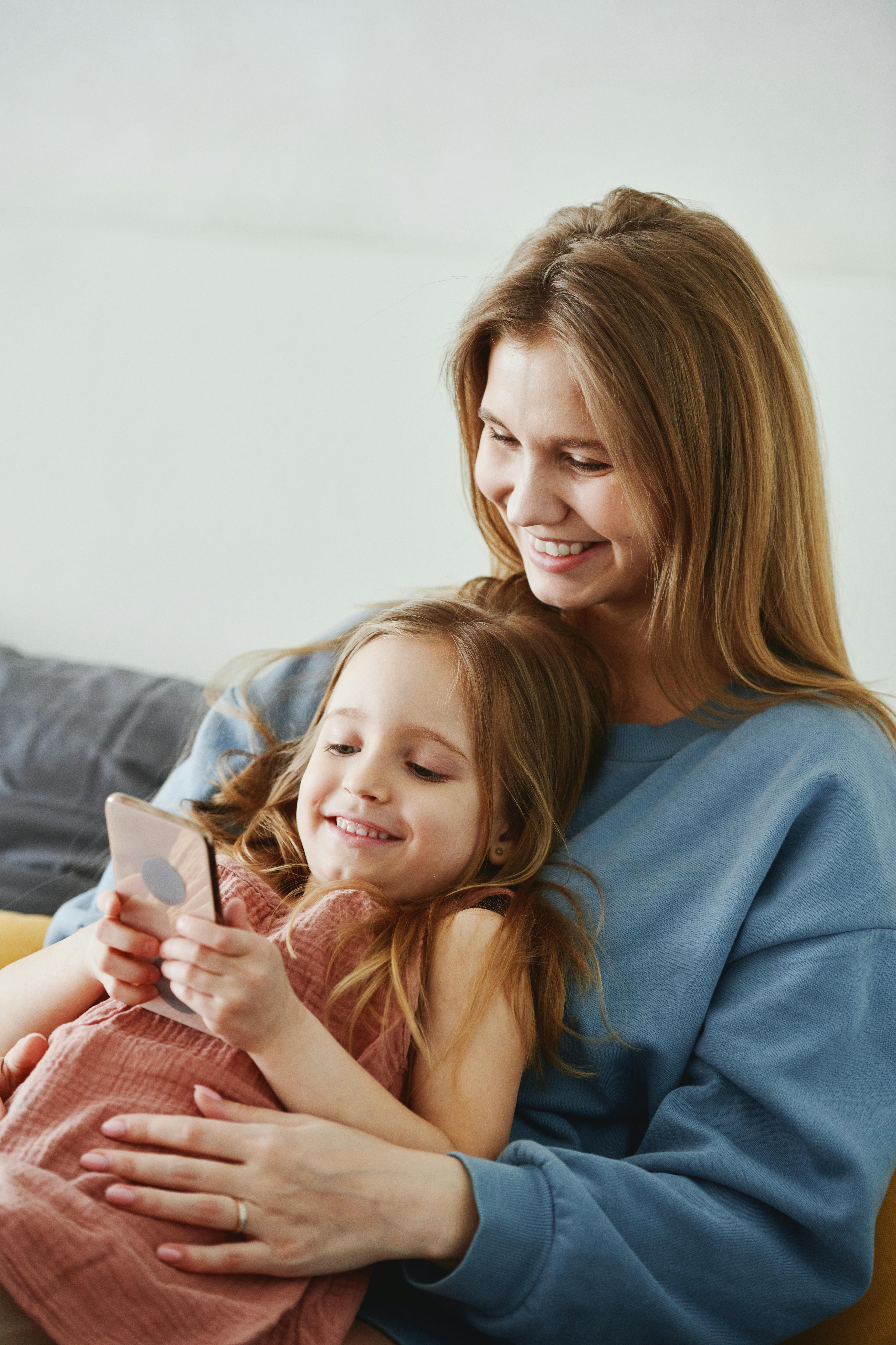 Family reviewing a phone use agreement on a device